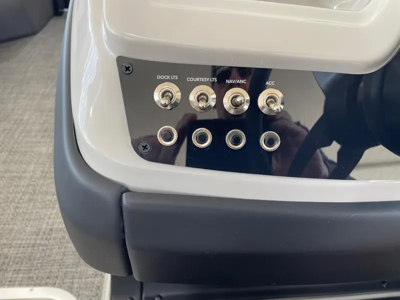 Slide: The Image of Control panel of 2024 Barletta Cabrio 22UC boat with labeled switches. - 42