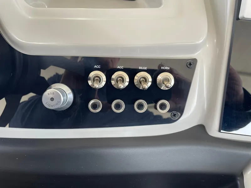 Slide: The Image of Control panel of 2024 Barletta Cabrio 22UC with switches for ACC, bilge, and horn. - 43