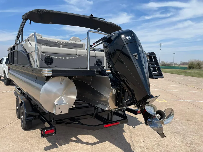 Slide: The Image of 2024 Barletta Cabrio 22UC pontoon boat with powerful outboard motor on trailer. - 7