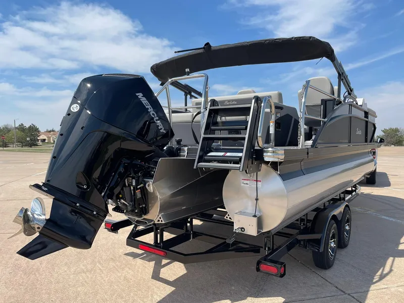 Slide: The Image of 2024 Barletta Cabrio 22UC pontoon boat with Mercury outboard engine on trailer. - 9