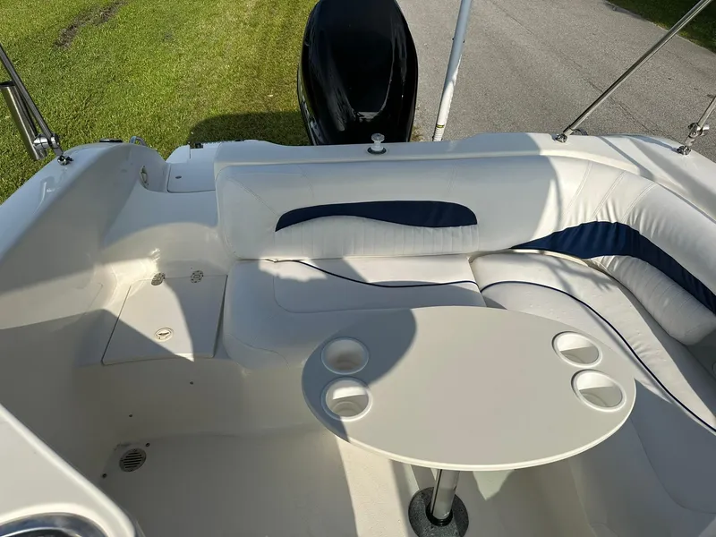 Slide: The Image of 2008 NauticStar 23DC boat interior with seating and table. - 10