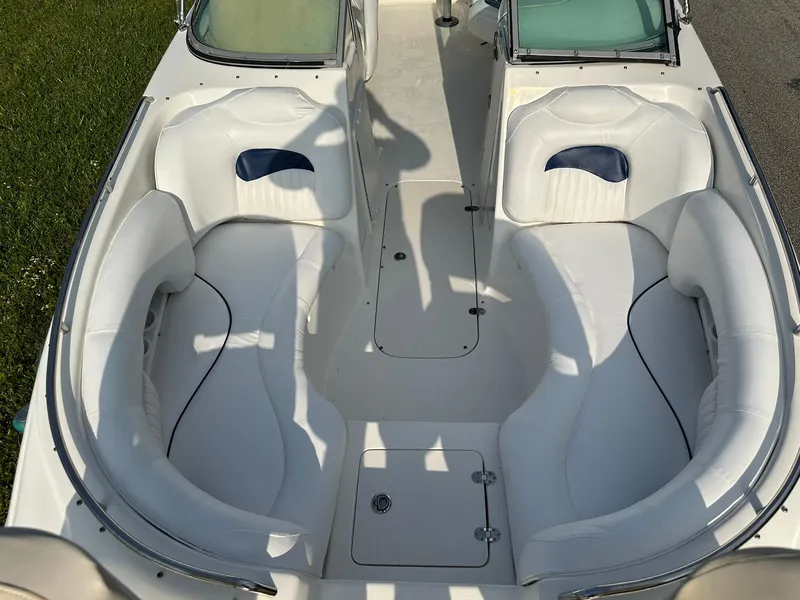 Slide: The Image of 2008 NauticStar 23DC boat with white cushioned seating and dual consoles. - 20