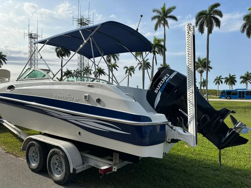 Slide: The Image of 2008 NauticStar 23DC boat on trailer with Suzuki outboard motor. - 4