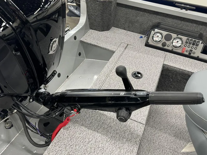 Slide: The Image of 2024 Alumacraft Voyageur 175 Tiller boat controls and dashboard. - 5