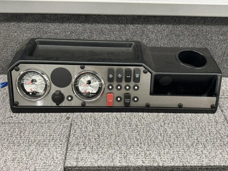 Slide: The Image of 2024 Alumacraft Voyageur 175 Tiller dashboard with gauges and controls. - 6