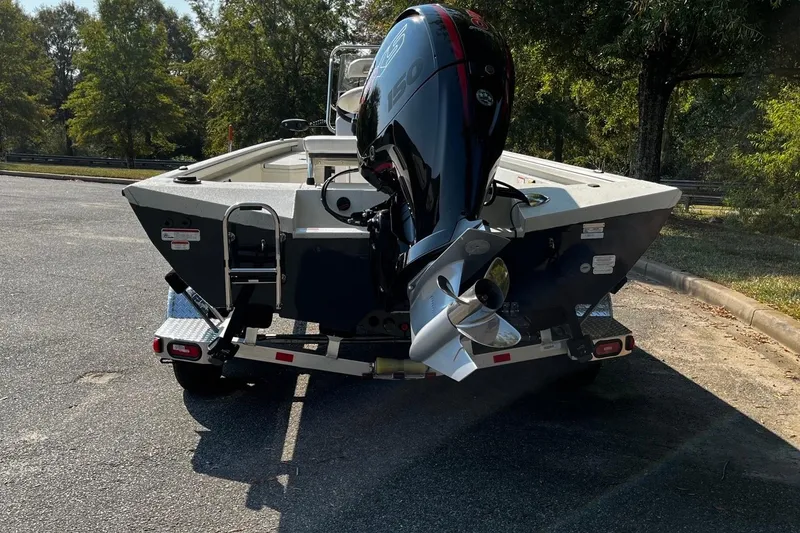 Slide: The Image of 2024 Ranger RB210 boat with powerful outboard motor on a trailer. - 4