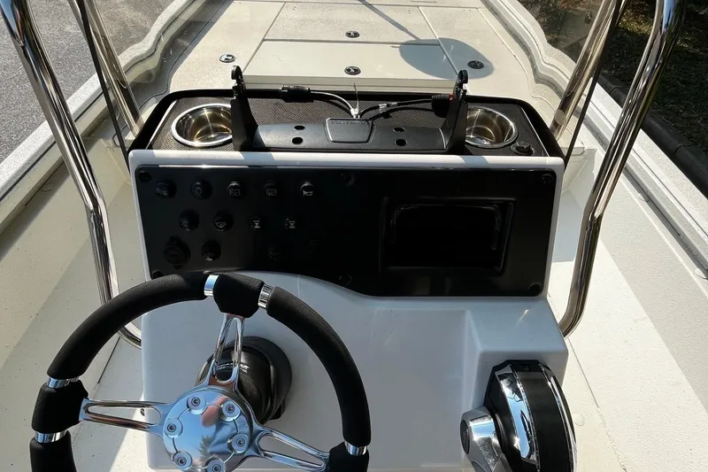 Slide: The Image of 2024 Ranger RB210 boat console with steering wheel and control panel. - 6