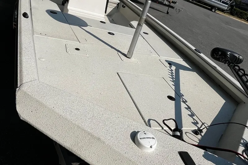 Slide: The Image of 2024 Ranger RB210 boat deck with fishing equipment and storage compartments. - 7