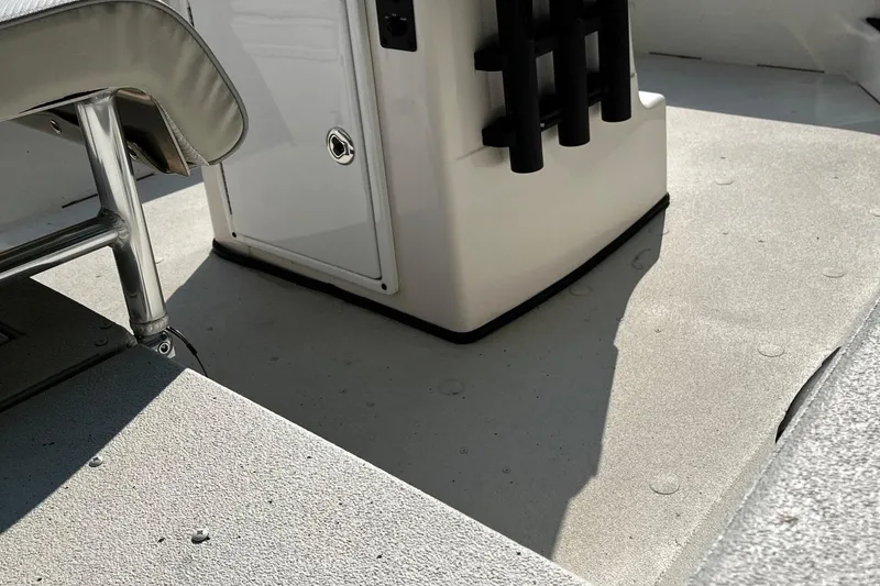 Slide: The Image of 2024 Ranger RB210 boat interior with seating and storage compartment. - 8