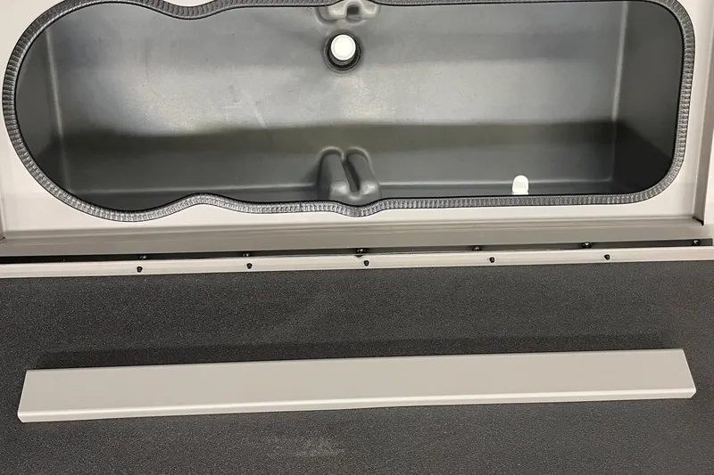 Slide: The Image of 2024 Ranger RB210 boat storage compartment with lid open. - 12