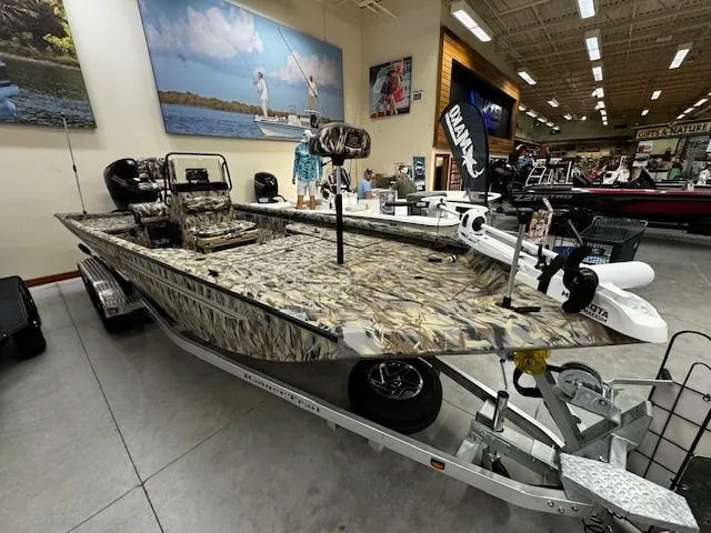 Slide: The Image of 2024 Ranger RB210 camo fishing boat on display in showroom. - 5