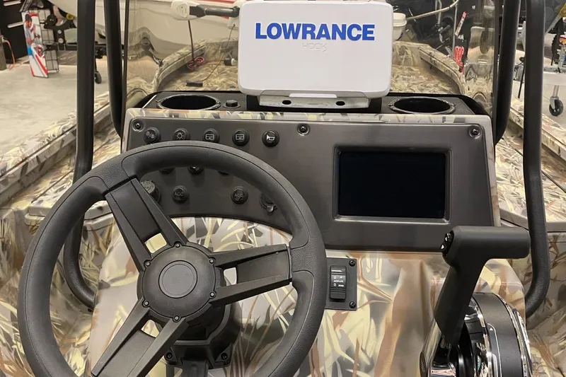 Slide: The Image of 2024 Ranger RB210 boat dashboard with Lowrance navigation system. - 7
