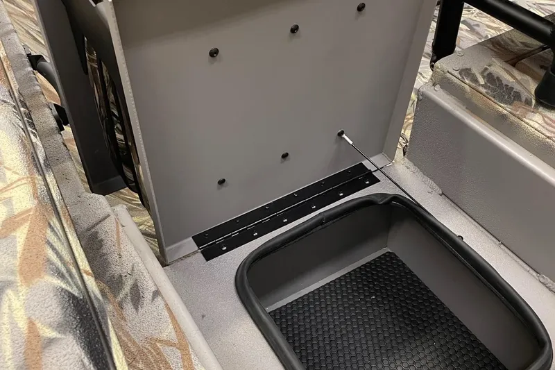 Slide: The Image of 2024 Ranger RB210 boat interior with storage compartment and non-slip flooring. - 9