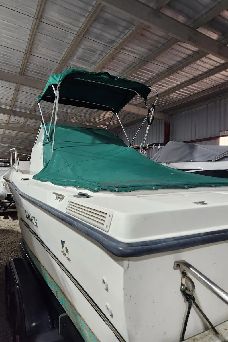 Slide: The Image of 2000 Renken Seamaster 2288 WA boat with green canopy and cover. - 4