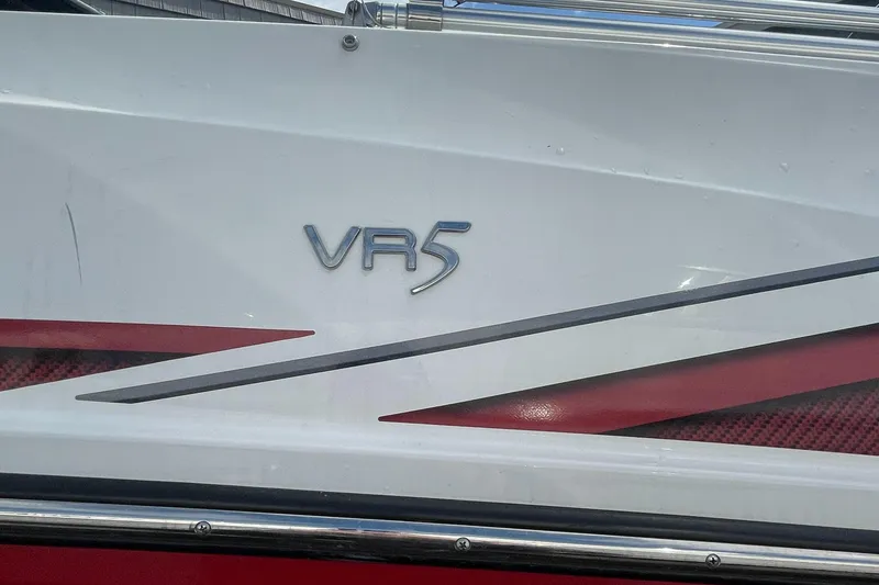 Slide: The Image of 2021 Bayliner VR5 boat exterior with logo and red accents. - 5