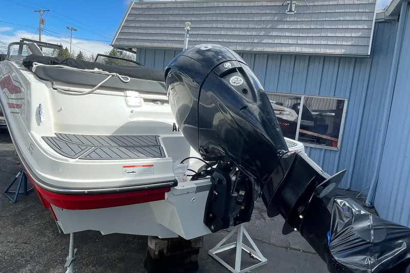 Slide: The Image of 2021 Bayliner VR5 boat with outboard motor in a marina. - 6