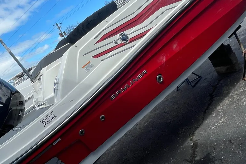 Slide: The Image of 2021 Bayliner VR5 boat with red and white exterior. - 9