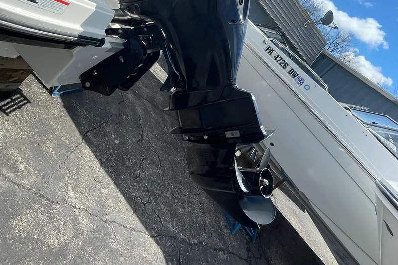 Slide: The Image of 2021 Bayliner VR5 boat with outboard motor on a trailer. - 4