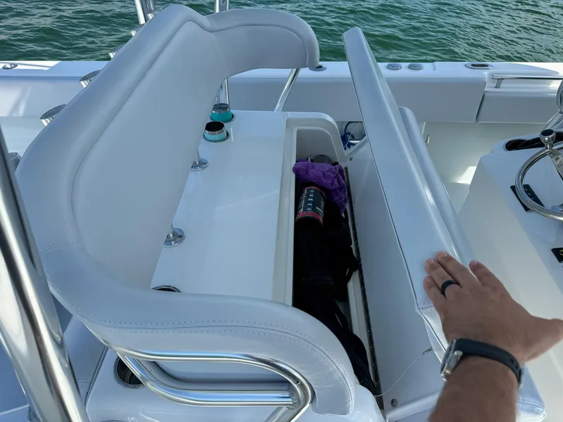 Slide: The Image of 2022 Contender 39 ST boat with open storage compartment. - 15