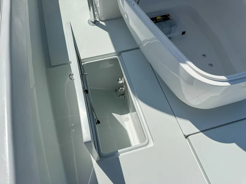 Slide: The Image of 2022 Contender 39 ST boat deck with open storage compartments. - 22