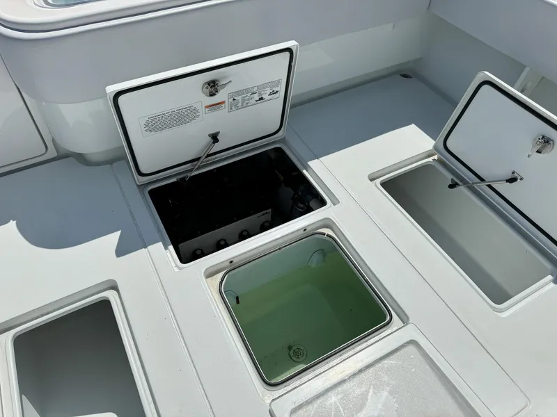 Slide: The Image of 2022 Contender 39 ST boat storage compartments and livewell. - 30