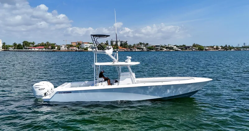 Slide: The Image of 2022 Contender 39 ST boat cruising on a sunny day. - 4