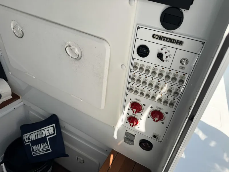 Slide: The Image of Control panel of a 2022 Contender 39 ST boat with Yamaha branding. - 41