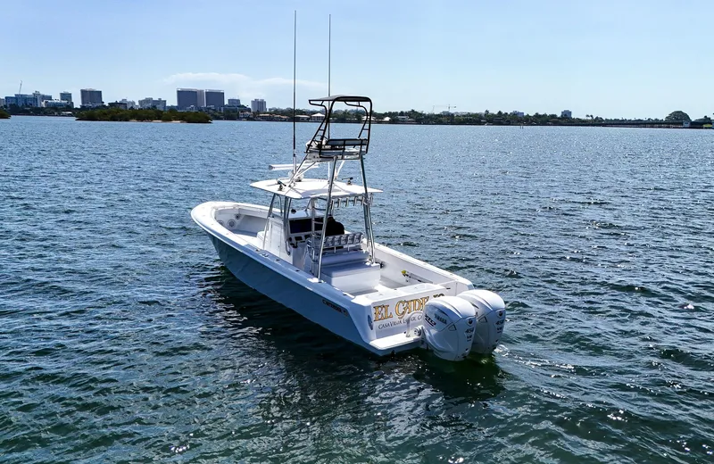 Slide: The Image of 2022 Contender 39 ST boat on open water with city skyline in background. - 44