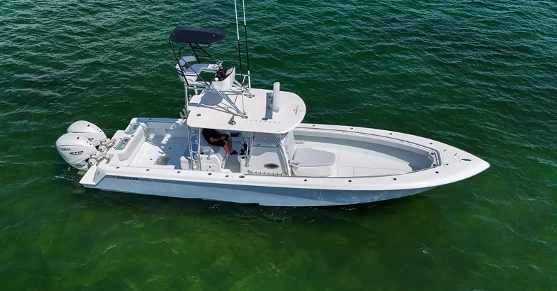 Slide: The Image of 2022 Contender 39 ST boat on clear green water. - 5