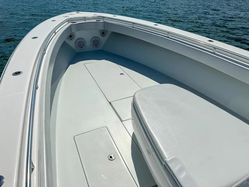 Slide: The Image of 2022 Contender 39 ST boat bow area with seating and storage compartments. - 9