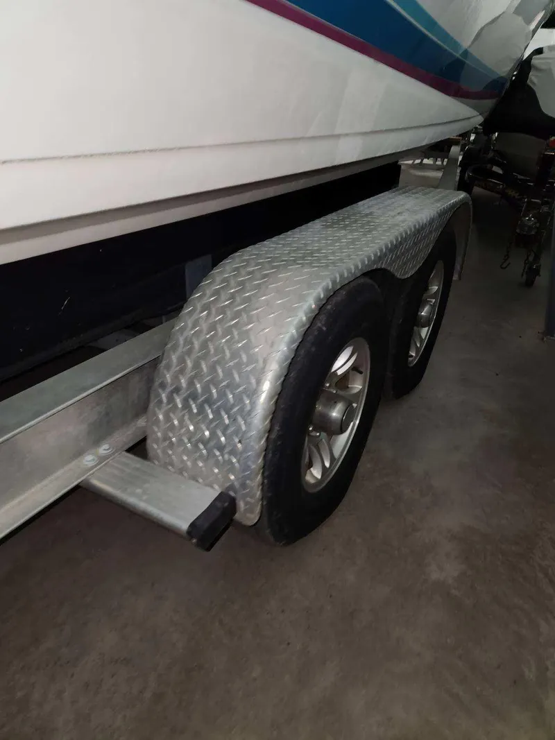Slide: The Image of 1993 Formula 303 SR1 boat on a trailer with diamond plate fenders. - 10