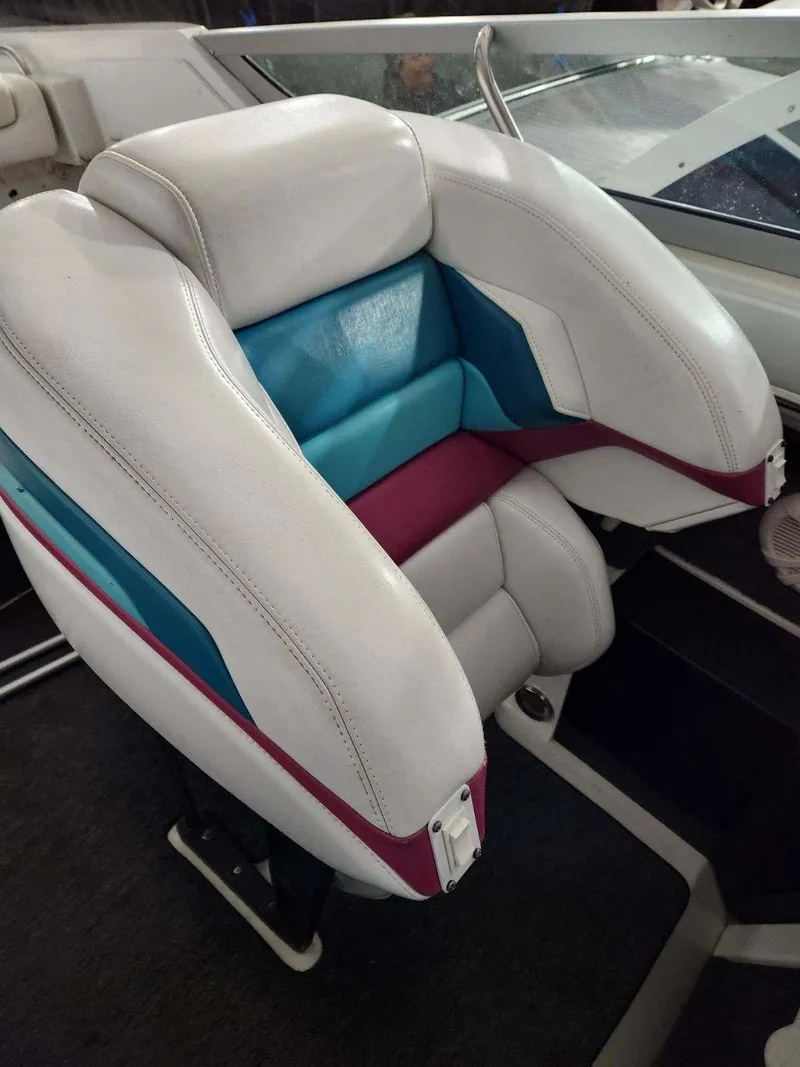 Slide: The Image of 1993 Formula 303 SR1 boat seat with white, teal, and maroon upholstery. - 13