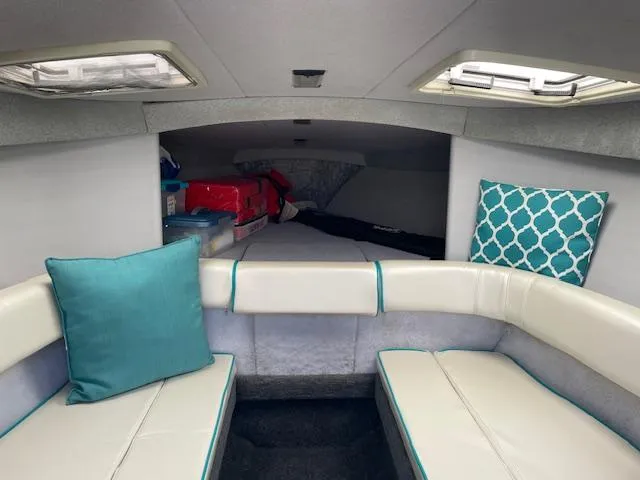 Slide: The Image of Interior cabin of a 1993 Formula 303 SR1 boat with seating and cushions. - 18