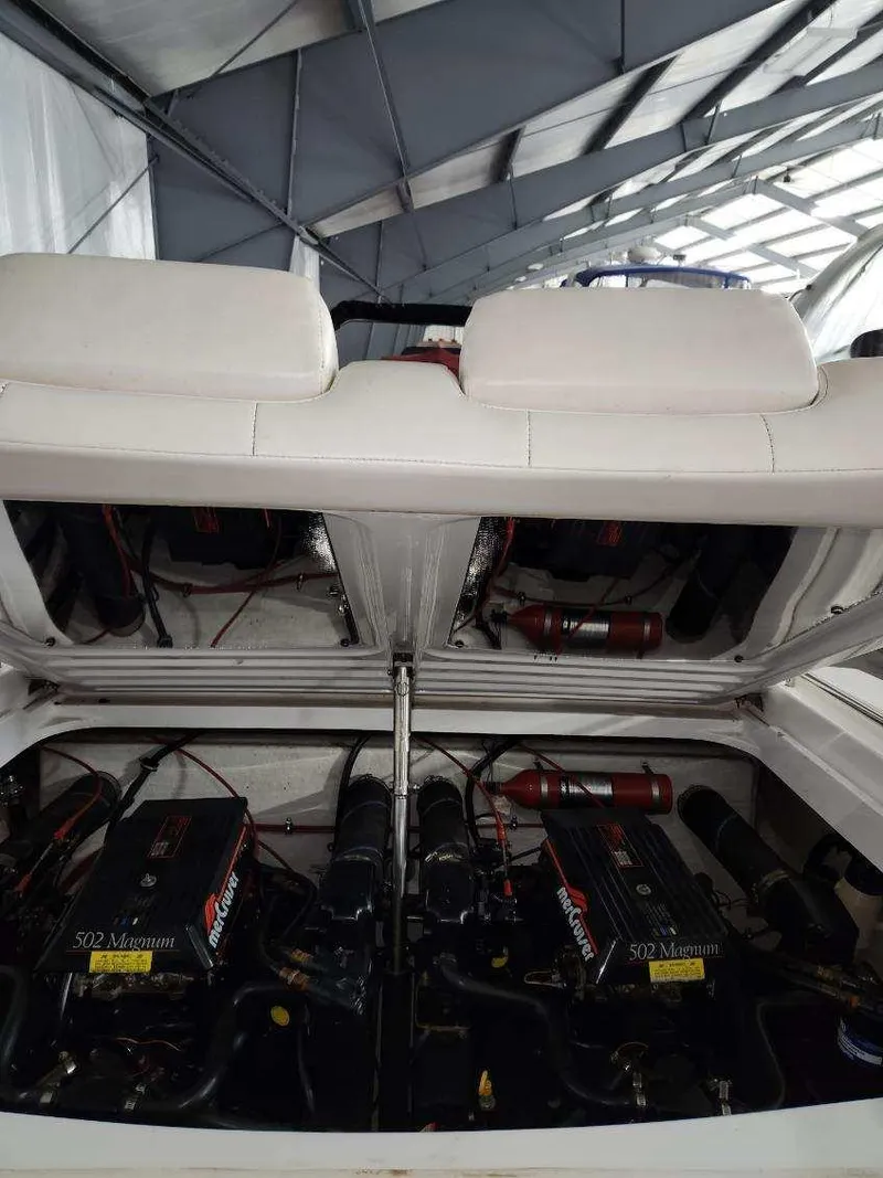 Slide: The Image of 1993 Formula 303 SR1 boat engine compartment with twin MerCruiser 502 Magnum engines. - 5