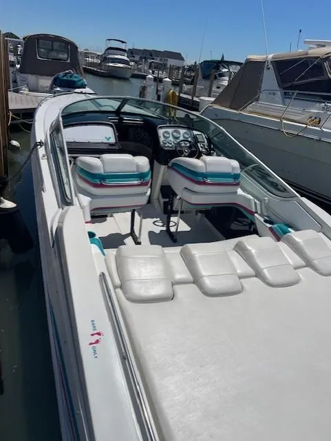 Slide: The Image of 1993 Formula 303 SR1 speedboat docked at a marina. - 6