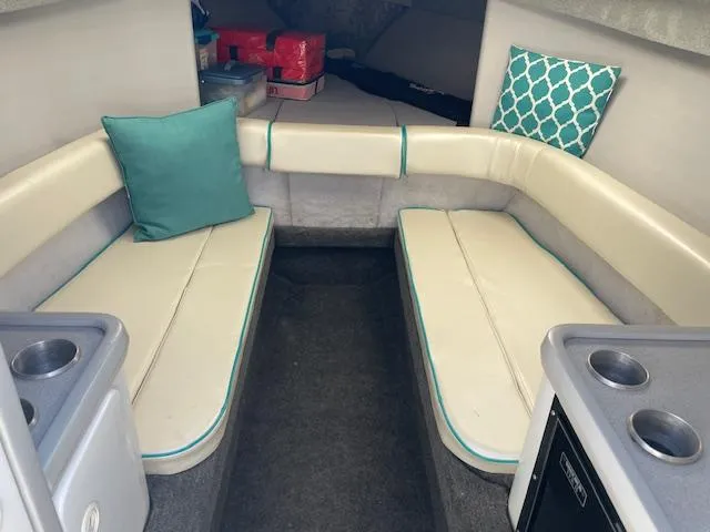 Slide: The Image of Interior cabin of a 1993 Formula 303 SR1 boat with seating and cushions. - 7