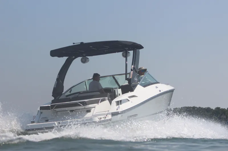 Slide: The Image of 2023 Monterey 298SS speedboat cruising on water. - 15