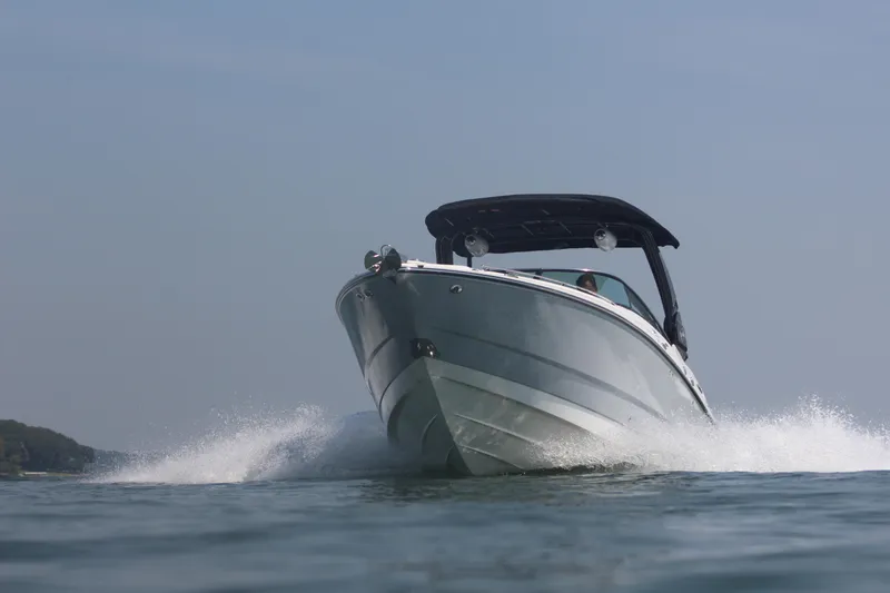 Slide: The Image of 2023 Monterey 298SS speedboat cruising on open water. - 16