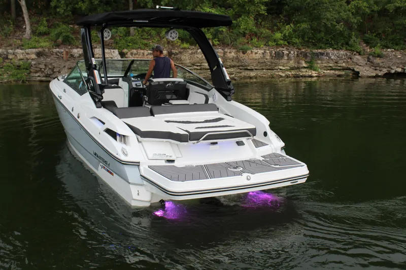 Slide: The Image of 2023 Monterey 298SS boat with purple underwater lights on a lake. - 26