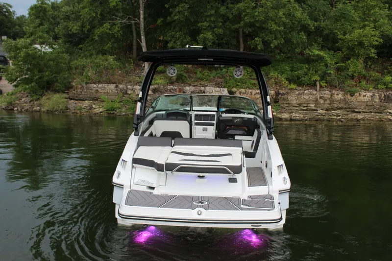 Slide: The Image of 2023 Monterey 298SS boat with purple underwater lights on a lake. - 27