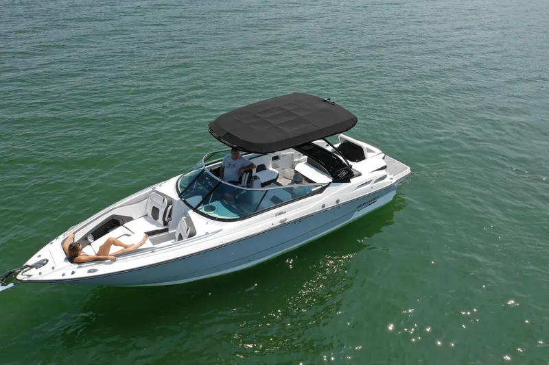 Slide: The Image of 2023 Monterey 298SS boat cruising on clear water with passengers. - 3