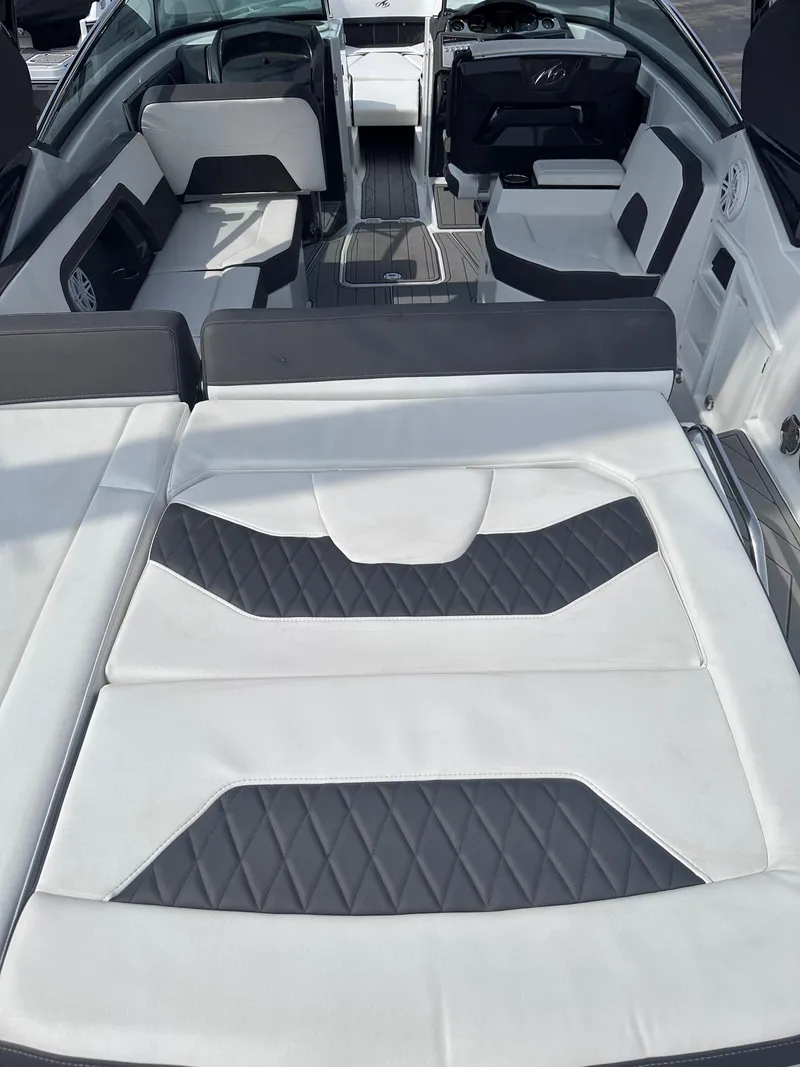 Slide: The Image of 2023 Monterey 298SS boat interior with luxurious white and gray seating. - 33