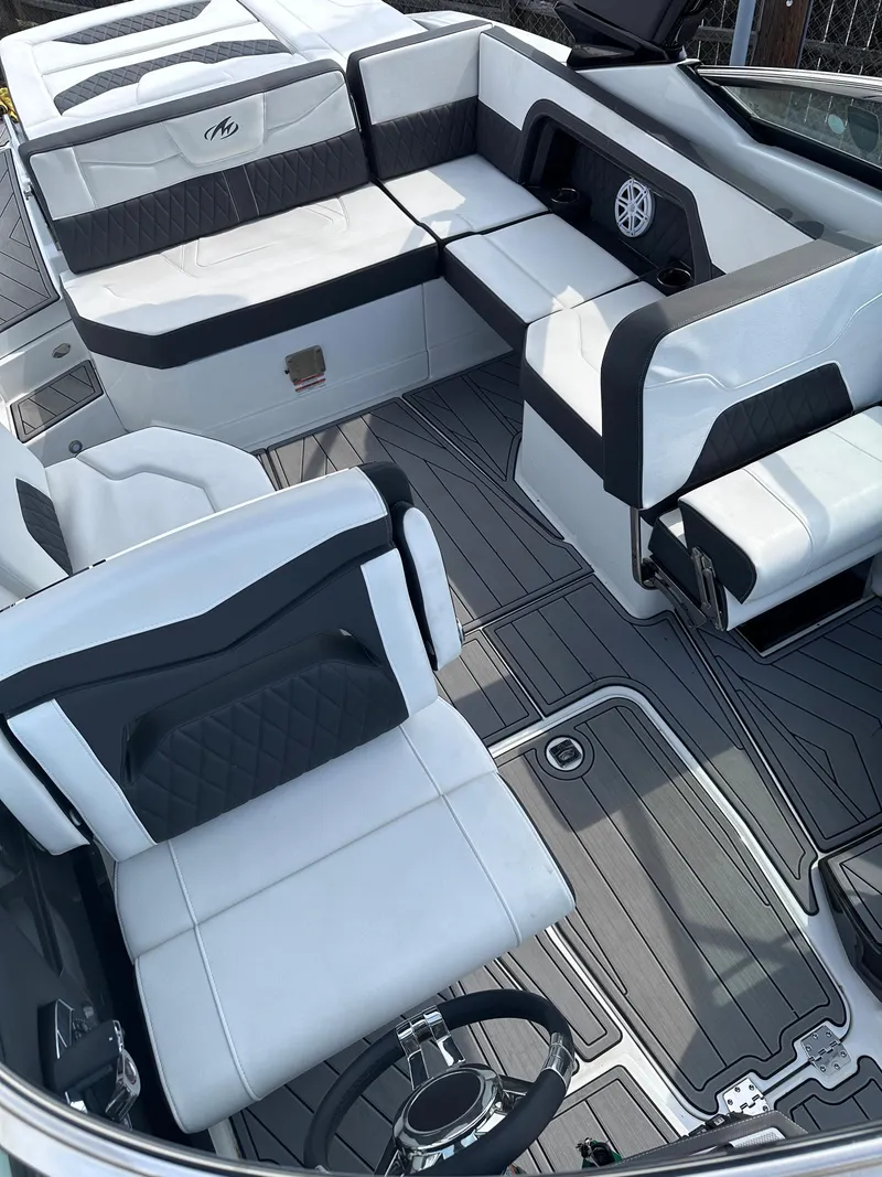 Slide: The Image of 2023 Monterey 298SS boat interior with white and black seating. - 41