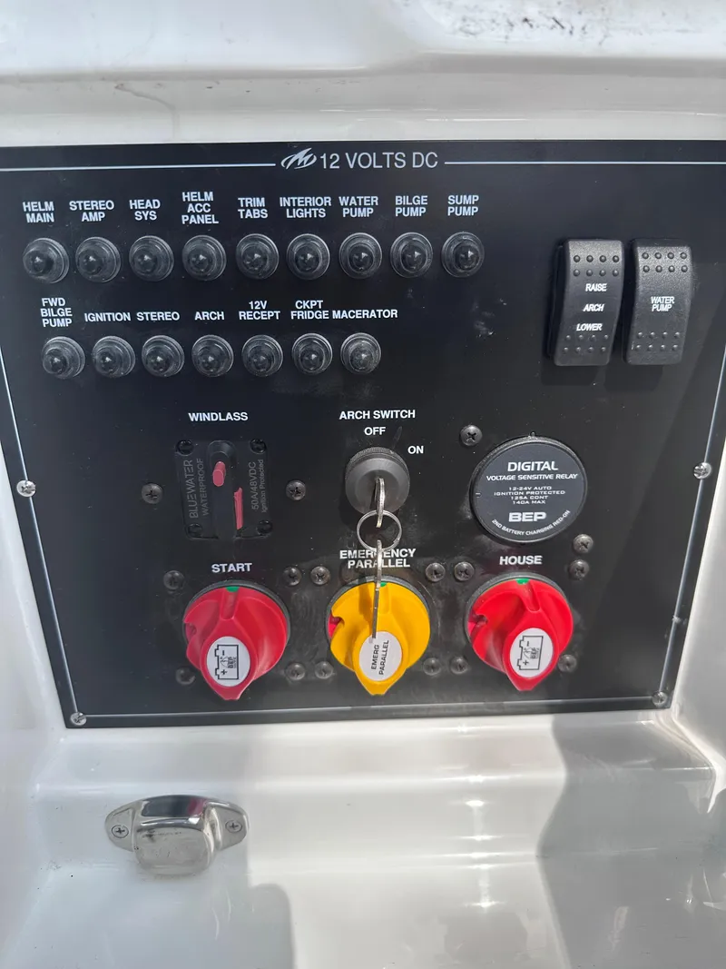 Slide: The Image of 2023 Monterey 298SS boat control panel with switches and battery selectors. - 44