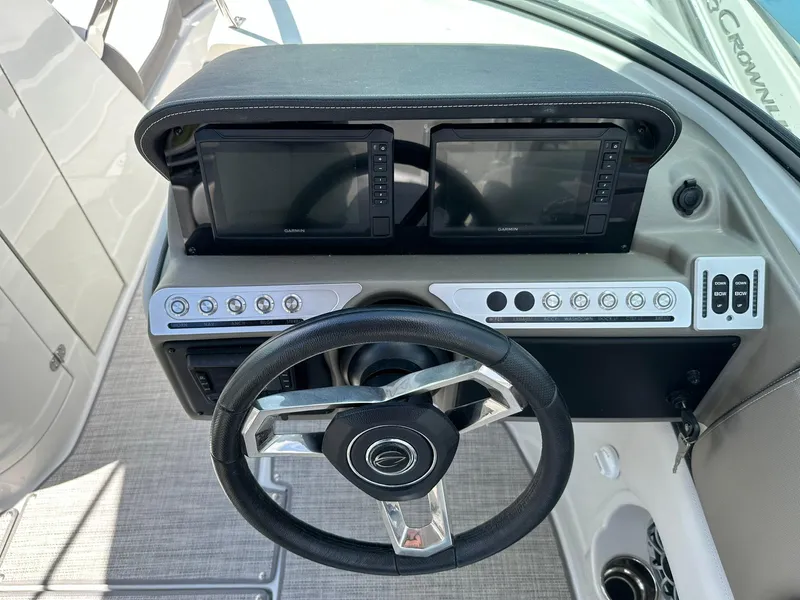 Slide: The Image of 2024 Crownline Eclipse E260 XS boat interior with luxurious seating and modern design. - 11