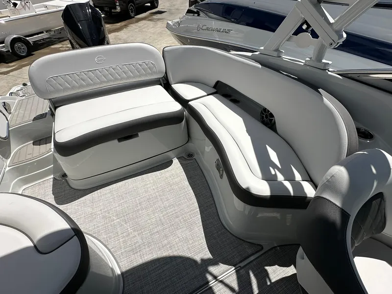 Slide: The Image of 2024 Crownline Eclipse E260 XS boat interior with sink and compact toilet. - 15
