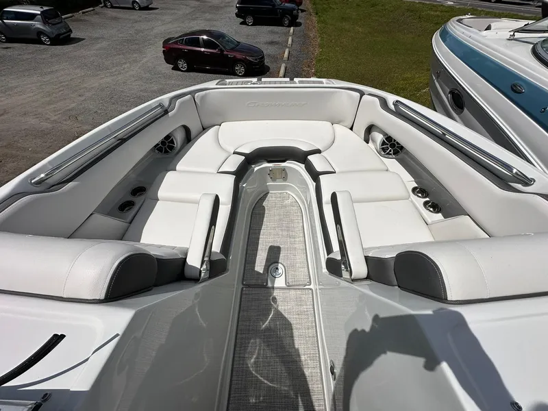 Slide: The Image of 2024 Crownline Eclipse E260 XS boat with Mercury engine on display in showroom. - 5