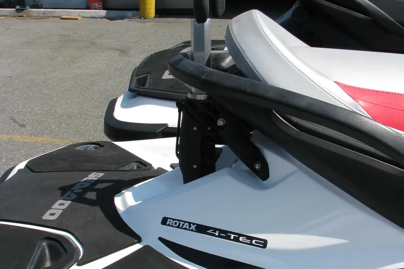 Slide: The Image of 2013 Sea-Doo WAKE PRO jet ski with Rotax 4-TEC engine, close-up view. - 2