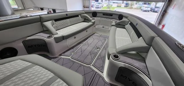 Slide: The Image of 2024 Mystic Powerboats 42 CC interior with luxurious seating and modern design. - 4