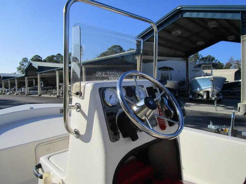 Slide: The Image of 2024 Carolina Skiff E Series E16 JVX CC boat console with steering wheel. - 11